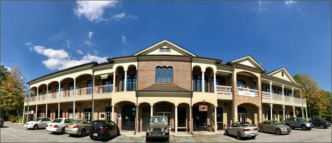 A pedestrian walks through Town Brookhaven, a mixed-use